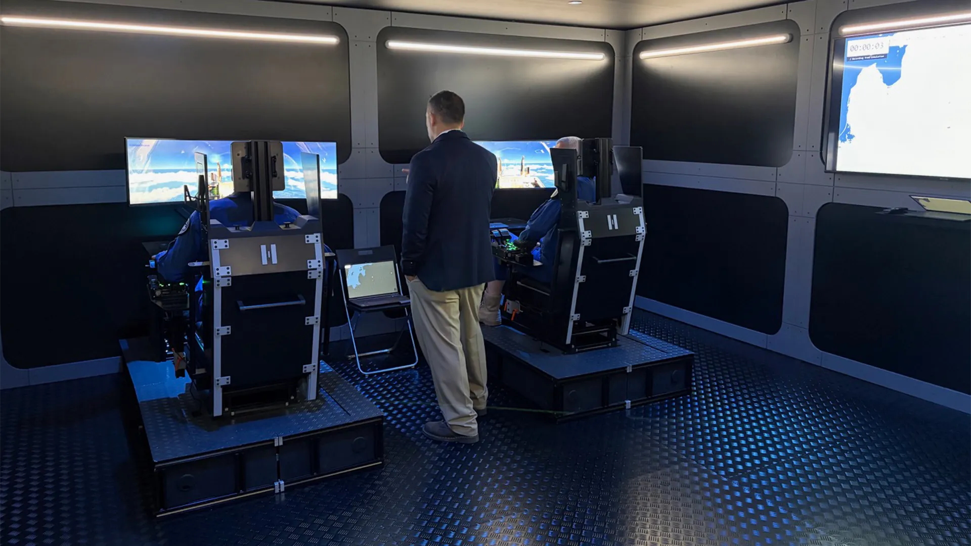 Visitors using interactive simulator stations inside Helsing’s chalet at ILA Berlin 2026